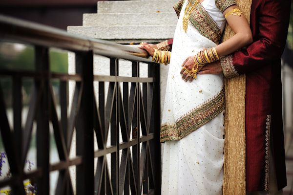Bride and groom in traditional Indian wedding clothes - photo by Kenny Nakai Photography